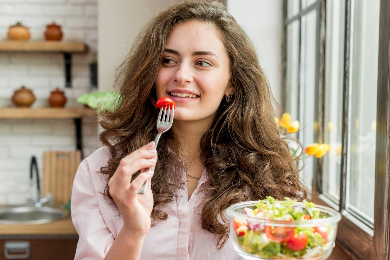 woman eating salad